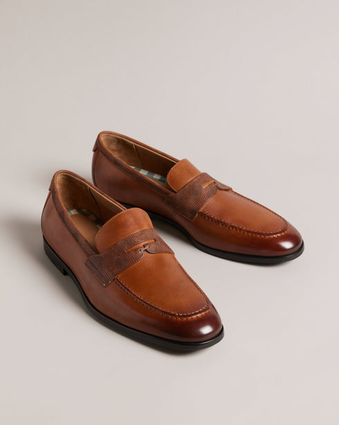 ADLERRC-Shoes-Step into timeless elegance with our ADLERRC loafers. Crafted from premium leather, they feature a sleek almond toe design that adds a touch of sophistication to any ensemble. Whether you're dressing up for a formal occasion or adding a touch of refinement to your everyday look, they're the perfect choice for the modern gentleman who appreciates classic style with a contemporary twist. Saddle loafers Leather upper Almond toe Slip on Resin sole Debossed stripe details- Ted Baker Romania
