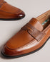 ADLERRC-Shoes-Step into timeless elegance with our ADLERRC loafers. Crafted from premium leather, they feature a sleek almond toe design that adds a touch of sophistication to any ensemble. Whether you're dressing up for a formal occasion or adding a touch of refinement to your everyday look, they're the perfect choice for the modern gentleman who appreciates classic style with a contemporary twist. Saddle loafers Leather upper Almond toe Slip on Resin sole Debossed stripe details- Ted Baker Romania