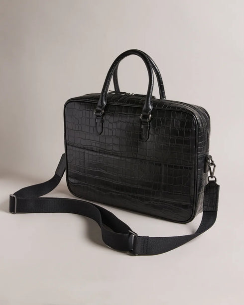 FABIANN-Bags-The FABIANN document bag blends style and functionality with effortless finesse. Inside, you'll find a padded pocket designed to fit a 15" laptop and a trolley slip that makes it the ideal travel companion for business trips and beyond. Document bag Croc effect leather Removable twill shoulder strap Two top handles Zip fastening Ted Baker logo Trolley slip Padded pocket fits 15" laptop Dimensions: 40cm x 8cm x 28cm- Ted Baker Romania