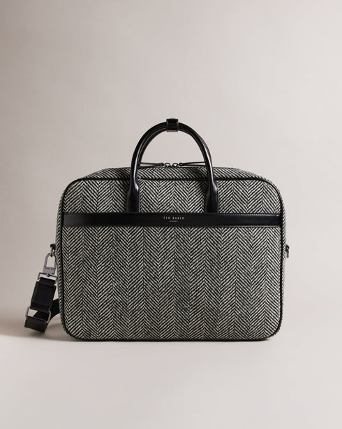 ANDREAZ-Bags-In a timeless herringbone texture, the ANDREAZ document bag combines classic style with modern functionality. It features a handy padded pocket to fit a 15" laptop, plus raised feet to protect it from wear and tear. Document bag Herringbone texture Zip fastening Two top handles with popper fastened holder Magnetic fastened front pocket Padded pocket to fit 15" laptop Raised feet Dimensions: 8cm x 28cm x 40cm- Ted Baker Romania