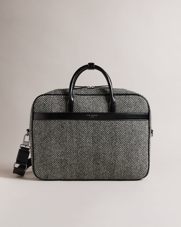 ANDREAZ-Bags-In a timeless herringbone texture, the ANDREAZ document bag combines classic style with modern functionality. It features a handy padded pocket to fit a 15" laptop, plus raised feet to protect it from wear and tear. Document bag Herringbone texture Zip fastening Two top handles with popper fastened holder Magnetic fastened front pocket Padded pocket to fit 15" laptop Raised feet Dimensions: 8cm x 28cm x 40cm- Ted Baker Romania