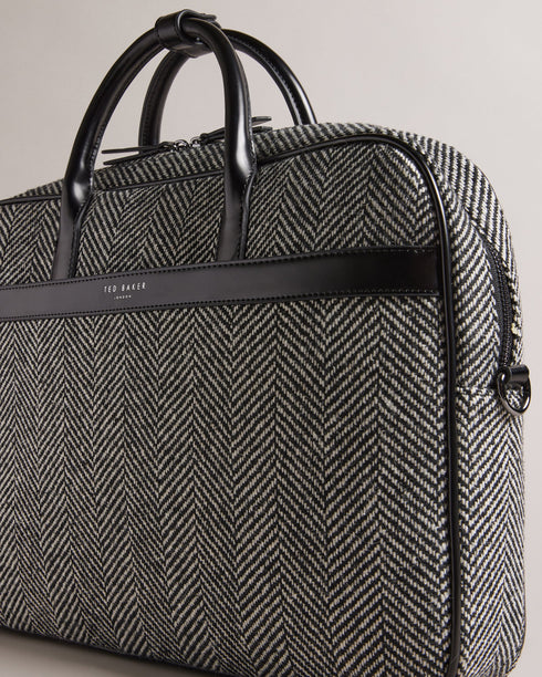 ANDREAZ-Bags-In a timeless herringbone texture, the ANDREAZ document bag combines classic style with modern functionality. It features a handy padded pocket to fit a 15" laptop, plus raised feet to protect it from wear and tear. Document bag Herringbone texture Zip fastening Two top handles with popper fastened holder Magnetic fastened front pocket Padded pocket to fit 15" laptop Raised feet Dimensions: 8cm x 28cm x 40cm- Ted Baker Romania