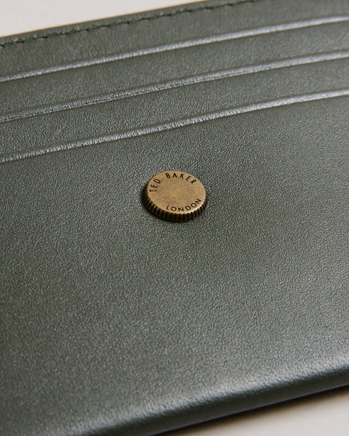 HACE-Wallets-Add a touch of luxury to your daily routine with our leather HACE card holder. The branded stud and rounded top edges enhance its visual appeal, while multiple card slots offer ample space for your essentials. Card holder Top grain leather Branded stud Rounded top edges Debossed logo Card slots Dimensions: 0.5cm x 7.8cm x 10cm- Ted Baker Romania