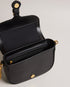 ESIA-Bags-Effortless glamour, meet ESIA. This saddle bag is crafted from luxurious leather, and you can keep even more essentials close at hand with the convenient back slip pocket. For a personalised touch, the removable branded webbing strap allows you to switch up your look effortlessly. Leather crossbody saddle bag Magnetic fastening with buckle tab Chain shoulder strap with padded leather panel Removable branded webbing strap Logo hardware Back slip pocket Dimensions: 5cm x 16.5cm x 21cm- Ted Baker Rom