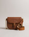 ESIA-Bags-Effortless glamour, meet ESIA. This saddle bag is crafted from luxurious leather, and you can keep even more essentials close at hand with the convenient back slip pocket. For a personalised touch, the removable branded webbing strap allows you to switch up your look effortlessly. Leather crossbody saddle bag Magnetic fastening with buckle tab Chain shoulder strap with padded leather panel Removable branded webbing strap Logo hardware Back slip pocket Dimensions: 5cm x 16.5cm x 21cm- Ted Baker Rom