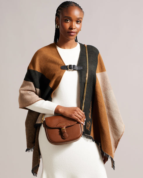 ESIA-Bags-Effortless glamour, meet ESIA. This saddle bag is crafted from luxurious leather, and you can keep even more essentials close at hand with the convenient back slip pocket. For a personalised touch, the removable branded webbing strap allows you to switch up your look effortlessly. Leather crossbody saddle bag Magnetic fastening with buckle tab Chain shoulder strap with padded leather panel Removable branded webbing strap Logo hardware Back slip pocket Dimensions: 5cm x 16.5cm x 21cm- Ted Baker Rom