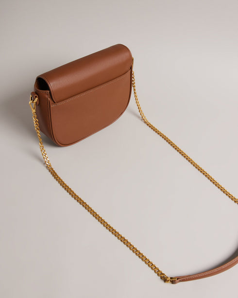 ESIA-Bags-Effortless glamour, meet ESIA. This saddle bag is crafted from luxurious leather, and you can keep even more essentials close at hand with the convenient back slip pocket. For a personalised touch, the removable branded webbing strap allows you to switch up your look effortlessly. Leather crossbody saddle bag Magnetic fastening with buckle tab Chain shoulder strap with padded leather panel Removable branded webbing strap Logo hardware Back slip pocket Dimensions: 5cm x 16.5cm x 21cm- Ted Baker Rom