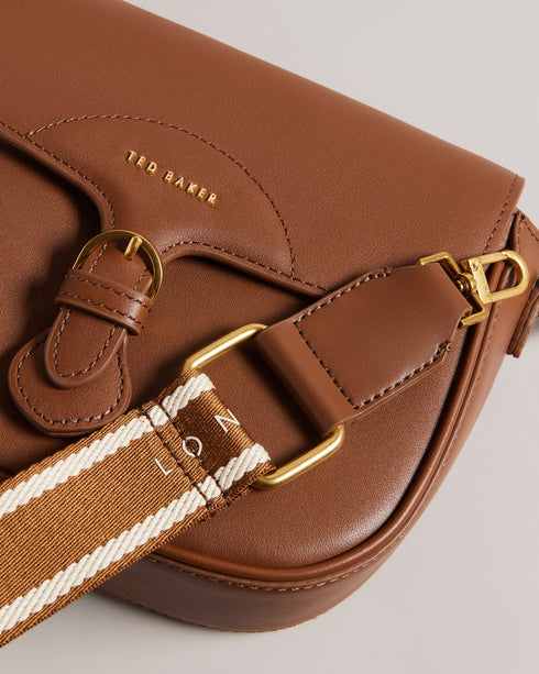 ESIA-Bags-Effortless glamour, meet ESIA. This saddle bag is crafted from luxurious leather, and you can keep even more essentials close at hand with the convenient back slip pocket. For a personalised touch, the removable branded webbing strap allows you to switch up your look effortlessly. Leather crossbody saddle bag Magnetic fastening with buckle tab Chain shoulder strap with padded leather panel Removable branded webbing strap Logo hardware Back slip pocket Dimensions: 5cm x 16.5cm x 21cm- Ted Baker Rom