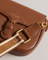 ESIA-Bags-Effortless glamour, meet ESIA. This saddle bag is crafted from luxurious leather, and you can keep even more essentials close at hand with the convenient back slip pocket. For a personalised touch, the removable branded webbing strap allows you to switch up your look effortlessly. Leather crossbody saddle bag Magnetic fastening with buckle tab Chain shoulder strap with padded leather panel Removable branded webbing strap Logo hardware Back slip pocket Dimensions: 5cm x 16.5cm x 21cm- Ted Baker Rom