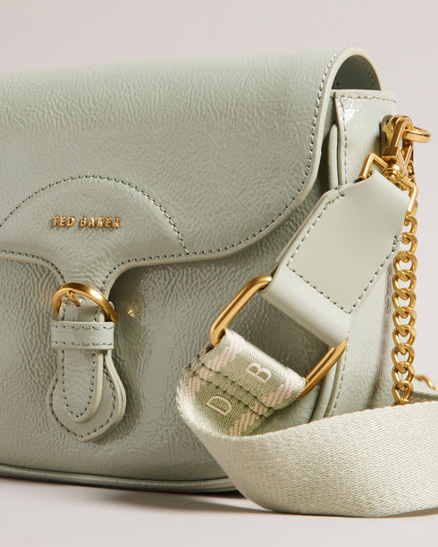 ESIA-Bags-Effortless glamour, meet ESIA. This saddle bag is crafted from luxurious leather, and you can keep even more essentials close at hand with the convenient back slip pocket. For a personalised touch, the removable branded webbing strap allows you to switch up your look effortlessly. Leather crossbody saddle bag Magnetic fastening with buckle tab Chain shoulder strap with padded leather panel Removable branded webbing strap Logo hardware Back slip pocket Dimensions: 5cm x 16.5cm x 21cm- Ted Baker Rom
