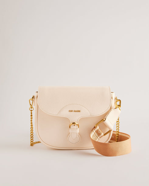 ESIA-Bags-Effortless glamour, meet ESIA. This saddle bag is crafted from luxurious leather, and you can keep even more essentials close at hand with the convenient back slip pocket. For a personalised touch, the removable branded webbing strap allows you to switch up your look effortlessly. Leather crossbody saddle bag Magnetic fastening with buckle tab Chain shoulder strap with padded leather panel Removable branded webbing strap Logo hardware Back slip pocket Dimensions: 5cm x 16.5cm x 21cm- Ted Baker Rom