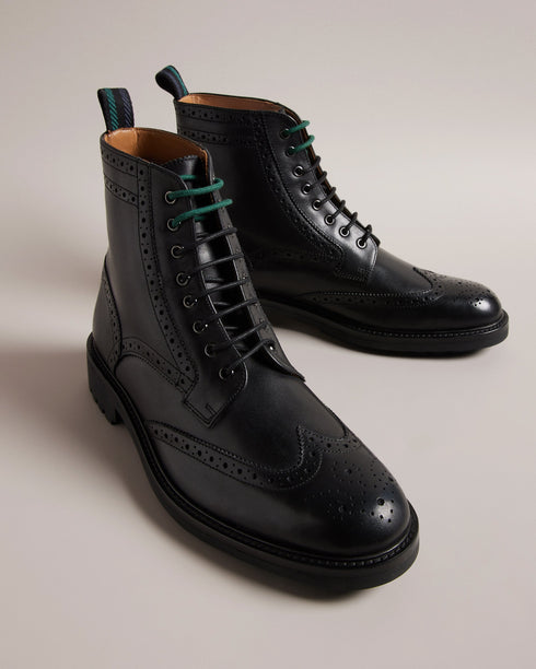 JAKOBE-Boots-Step up your footwear game with our JAKOBE leather boots. Crafted from top grain leather, these boots boast a lace fastening with eye-catching two-tone laces that add a touch of unique charm. The laser-cut brogue details provide a dash of classic style, while the heel pull tab ensures easy on-and-off. Leather boots Top grain leather Lace fastening Two-tone laces Laser cut brogue details Heel pull tab Vulcanised rubber sole- Ted Baker Romania