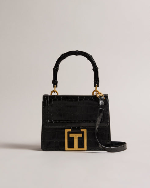 AALICCE-Bags-Whether You're Heading To A Brunch Date Or A Night Out With Friends The Aalicce Bag Is The Ideal Companion To Elevate Your Style And Keep Your Essentials Close At Hand. Crafted From High-quality Faux Leather With A Chic Croc Texture This Crossbody Features A Bamboo Top Handle And Statement Hardware For A Modern Edge. Crossbody bag Faux leather Croc texture Bamboo top handle Statement T hardware Adjustable shoulder strap Dimensions: 5.5cm x 15cm x 18cm- Ted Baker Romania