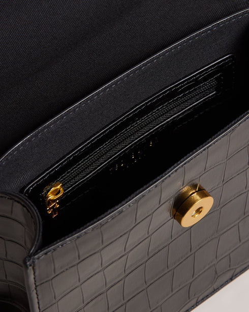 AALICCE-Bags-Whether You're Heading To A Brunch Date Or A Night Out With Friends The Aalicce Bag Is The Ideal Companion To Elevate Your Style And Keep Your Essentials Close At Hand. Crafted From High-quality Faux Leather With A Chic Croc Texture This Crossbody Features A Bamboo Top Handle And Statement Hardware For A Modern Edge. Crossbody bag Faux leather Croc texture Bamboo top handle Statement T hardware Adjustable shoulder strap Dimensions: 5.5cm x 15cm x 18cm- Ted Baker Romania