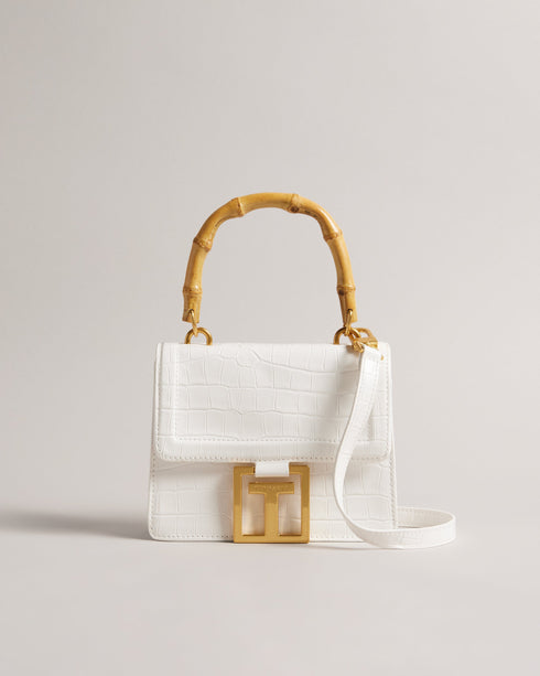 AALICCE-Bags-Whether You're Heading To A Brunch Date Or A Night Out With Friends The Aalicce Bag Is The Ideal Companion To Elevate Your Style And Keep Your Essentials Close At Hand. Crafted From High-quality Faux Leather With A Chic Croc Texture This Crossbody Features A Bamboo Top Handle And Statement Hardware For A Modern Edge. Crossbody bag Faux leather Croc texture Bamboo top handle Statement T hardware Adjustable shoulder strap Dimensions: 5.5cm x 15cm x 18cm- Ted Baker Romania