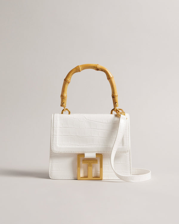 AALICCE-Bags-Whether You're Heading To A Brunch Date Or A Night Out With Friends The Aalicce Bag Is The Ideal Companion To Elevate Your Style And Keep Your Essentials Close At Hand. Crafted From High-quality Faux Leather With A Chic Croc Texture This Crossbody Features A Bamboo Top Handle And Statement Hardware For A Modern Edge. Crossbody bag Faux leather Croc texture Bamboo top handle Statement T hardware Adjustable shoulder strap Dimensions: 5.5cm x 15cm x 18cm- Ted Baker Romania