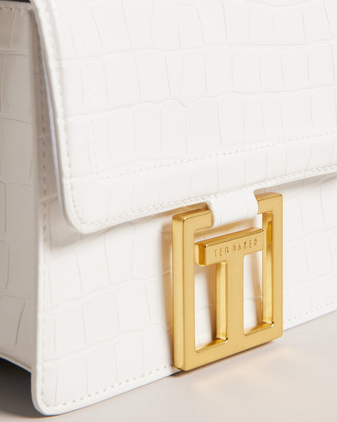 AALICCE-Bags-Whether You're Heading To A Brunch Date Or A Night Out With Friends The Aalicce Bag Is The Ideal Companion To Elevate Your Style And Keep Your Essentials Close At Hand. Crafted From High-quality Faux Leather With A Chic Croc Texture This Crossbody Features A Bamboo Top Handle And Statement Hardware For A Modern Edge. Crossbody bag Faux leather Croc texture Bamboo top handle Statement T hardware Adjustable shoulder strap Dimensions: 5.5cm x 15cm x 18cm- Ted Baker Romania