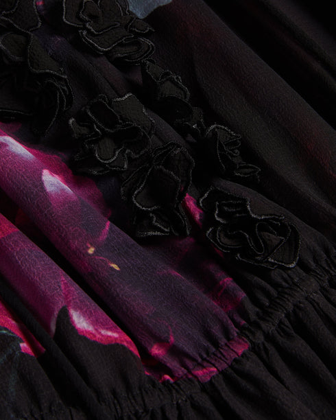 GIONNNA-Dresses-GIONNNA is all about the floaty silhouette. With a deep V-neck adorned with flowers, it's just the right amount of flirty and feminine. Whether you're attending a garden wedding or a summer soiree, this maxi dress is a stunning choice. Maxi dress Floaty silhouette Embroidered flowers on neckline Deep V-neck Fitted waist Blouson sleeve Frill details Effortless eleganceAn enchanting floaty silhouette and blouson sleeves offer a relaxed silhouette and capture the essence of timeless style.Whims