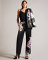 NAYAAT-Trousers-Embrace a bold and sophisticated style with our NAYAAT satin trousers. Featuring a captivating photographic floral print, these trousers effortlessly blend artistry and fashion. Their wide leg silhouette exudes an air of modern elegance, while the high waist and side pockets add practicality to the design. Satin trousers Photographic floral print Wide leg High waisted Belt loops Pockets Leg crease Matching jacket: NAYAA- Ted Baker Romania