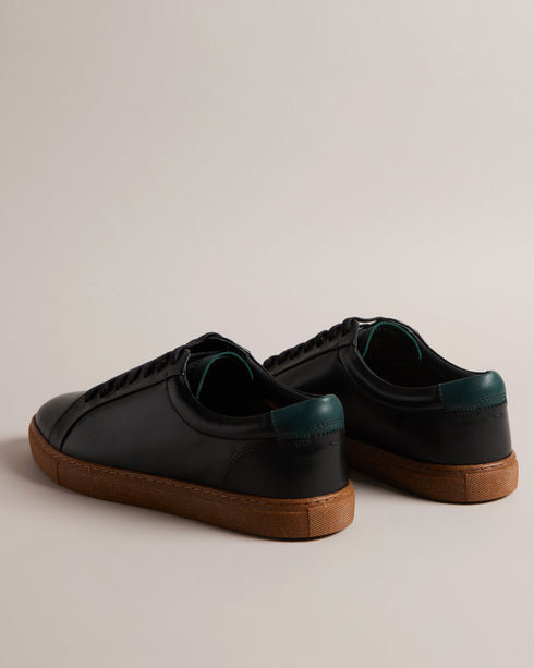 UDAMOU-Sneakers-Embrace comfort and style with every step you take in the UDAMOU trainers. Crafted from top grain leather, they offer a luxurious and durable finish. Their lace-up fastening ensures a secure fit, while the rubber sole provides excellent traction and support. Low top trainers Top grain leather Lace up fastening Rubber sole Almond toe- Ted Baker Romania