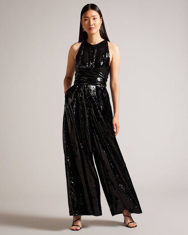 VIVALEE-Trousers-Party time means VIVALEE. Adorned with sequins, this floaty jumpsuit makes a statement. Pair with understated accessories to let it shine. Jumpsuit All over sequins Wide leg Wrapped waist Crew neck Sleeveless Hyunser is 5'10.5" / 1.79m and wears Black in a Ted size 1- Ted Baker Romania