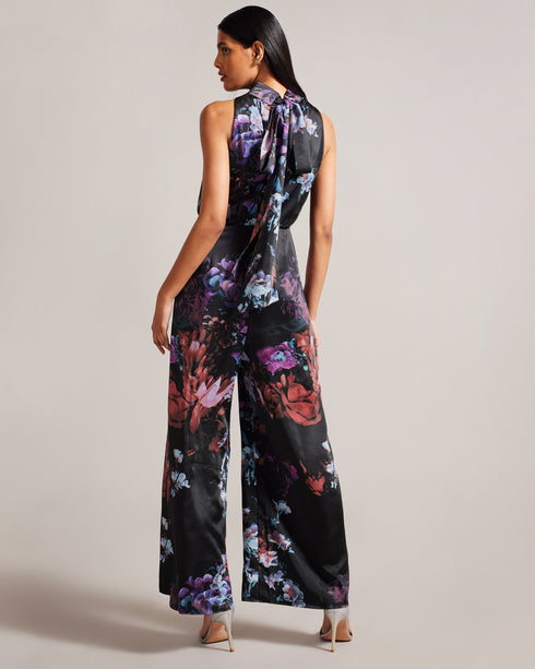 MARLEEH-Trousers-Dress to impress in MARLEEH. Featuring an oversized neck tie and a fitted waist, this sleeveless jumpsuit offers a sophisticated and flattering fit. Satin jumpsuit Floral print Wide leg Sleeveless Oversized neck tie Stand collar Fitted waist Zip fastening Samruddhi is 5'7" / 1.71m and wears Black in a Ted size 1- Ted Baker Romania