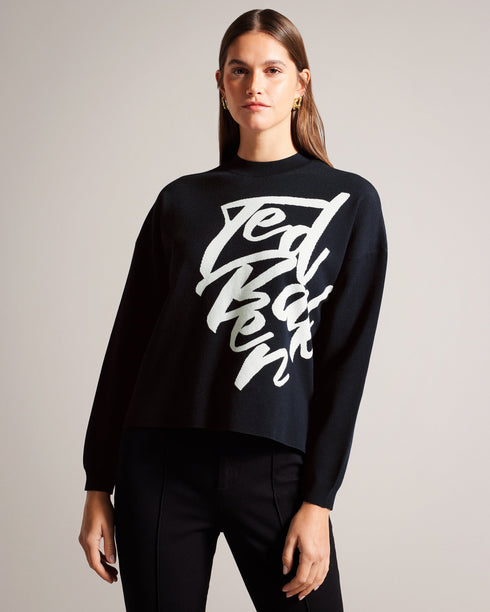 EMALLLY-Knitwear-EMALLLY is designed for ultimate comfort and effortless style. With its relaxed fit, this jumper is perfect for laid-back days. Complete with a classic crew neck and raw hem, this versatile jumper can be easily paired with your favorite jeans or leggings. Jumper Relaxed fit Jacquard logo Split raw hem Crew neck Long sleeves Elvira is 5'9" / 1.75m and wears Camel in a Ted size 1- Ted Baker Romania