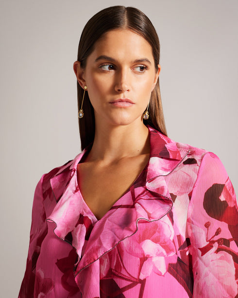 LUUCIIE-Tops-Let your stye bloom with the LUUCIIE blouse. With a flattering V-neckline and elegant sleeves, this blouse is perfect for both casual and dressy occasions. Flared cuffs add a playful detail to complete the look. Blouse Abstract floral print Ruffled front Metal ball trim V-neck Long sleeves Flared cuffs- Ted Baker Romania