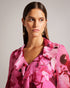 LUUCIIE-Tops-Let your stye bloom with the LUUCIIE blouse. With a flattering V-neckline and elegant sleeves, this blouse is perfect for both casual and dressy occasions. Flared cuffs add a playful detail to complete the look. Blouse Abstract floral print Ruffled front Metal ball trim V-neck Long sleeves Flared cuffs- Ted Baker Romania