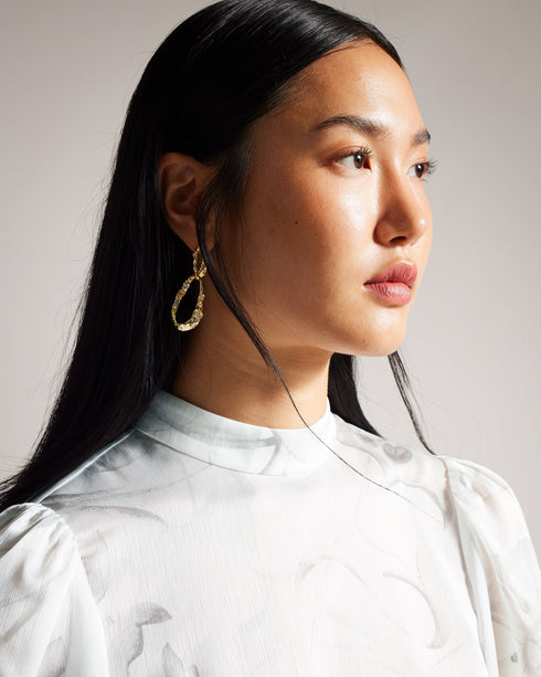 LILIOH-Tops-Unleash your inner flower child with LILIOH. With half-length balloon sleeves and a delicate floral print, it's perfect for when you want to make a statement without saying a word. Blouse Half length balloon sleeves High neck Half zip fastening Delicate floral print- Ted Baker Romania