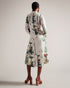 TTAYLA-Dresses-What's better than one floral print? TTAYLA. This shirt dress features our gorgeous floral collage print in a floaty easy-wearing silhouette. Midi dress Floral collage print Long shirt sleeves Waist tie Stand collar Concealed button placket Length: 126cm Ayo is 5'8" / 1.73m and wears Ivory in a Ted size 1- Ted Baker Romania