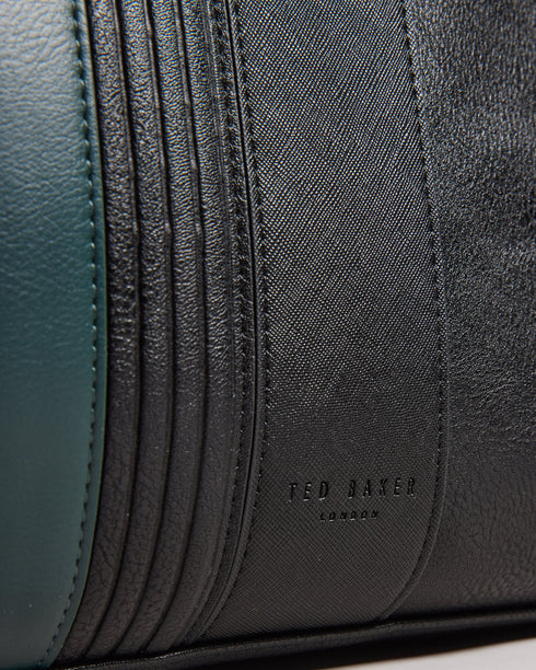 EVIAN-Bags-The embodiment of suave style, the EVIAN bowler bag in faux leather features a distinguished striped design. You'll find both top handles and an adjustable shoulder strap for versatility and comfort in carrying. Bowler bag Faux leather Striped design Top handles Adjustable shoulder strap Zip fastening Internal zip pocket Dimensions: 20cm x 28cm x 49cm- Ted Baker Romania