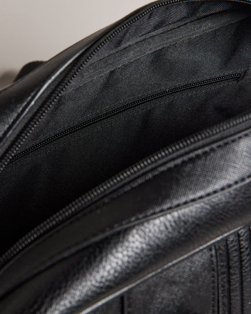 EVIAN-Bags-The embodiment of suave style, the EVIAN bowler bag in faux leather features a distinguished striped design. You'll find both top handles and an adjustable shoulder strap for versatility and comfort in carrying. Bowler bag Faux leather Striped design Top handles Adjustable shoulder strap Zip fastening Internal zip pocket Dimensions: 20cm x 28cm x 49cm- Ted Baker Romania