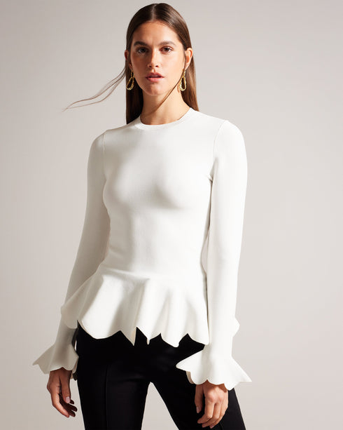 LILLYYY-Knitwear-A modern take on a classic silhouette, our LILLYYY top is the perfect pairing for any occasion. With long sleeves and scalloped trim, it’s easy to see why this one is a must-have. Peplum top Long sleeves with flared cuff Scalloped trim Crew neck Slim fit- Ted Baker Romania