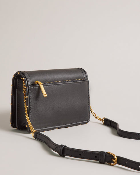 KAHNISA-goods-Carry around your card collection with KAHNISA. This leather purse has all of the card slots and zip compartments you'll ever need, with a fold over cover to keep them safe. The adjustable chain & leather shoulder strap allows for stylish carrying, finished with a studded trim for maximum style. Leather purse Studded trim Zip coin compartment Multiple card slots Foldover cover with magnetic fastening Adjustable chain and leather shoulder strap External zip pocket Dimensions: 10.5cm x 2.5cm- Te