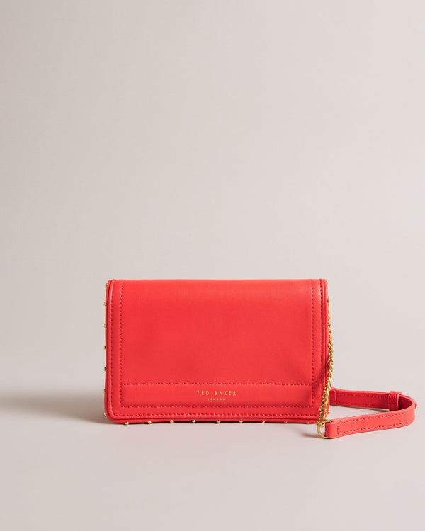 KAHNISA-goods-Carry around your card collection with KAHNISA. This leather purse has all of the card slots and zip compartments you'll ever need, with a fold over cover to keep them safe. The adjustable chain & leather shoulder strap allows for stylish carrying, finished with a studded trim for maximum style. Leather purse Studded trim Zip coin compartment Multiple card slots Foldover cover with magnetic fastening Adjustable chain and leather shoulder strap External zip pocket Dimensions: 10.5cm x 2.5cm- Te