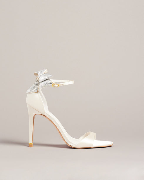 HEMARY-Sandals-We've made the perfect party shoe with HEMARY. With a stiletto heel and crystal embellished bow at the back, these satin sandals are as elegant as they are daring. Slip into the slim open toe strap and secure the buckle ankle fastening, and you're ready to dance the night away. Heeled sandals Satin finish Crystal bow embellishment Open toe Slim toe strap Stiletto heel with golden detail Buckle ankle strap- Ted Baker Romania