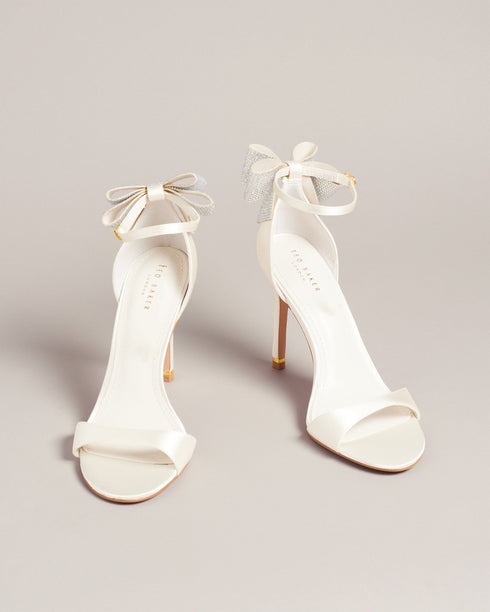 HEMARY-Sandals-We've made the perfect party shoe with HEMARY. With a stiletto heel and crystal embellished bow at the back, these satin sandals are as elegant as they are daring. Slip into the slim open toe strap and secure the buckle ankle fastening, and you're ready to dance the night away. Heeled sandals Satin finish Crystal bow embellishment Open toe Slim toe strap Stiletto heel with golden detail Buckle ankle strap- Ted Baker Romania