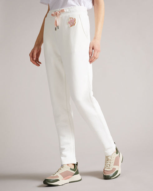 DORRINE-Trousers-A classic pair of jersey joggers are a wardrobe staple. Offering the best in comfort, DORRINE will take you from a workout to elevated loungewear without missing a beat. An embroidered magnolia and constrasting drawstring complete the look for a tried and true modern style. Ted Baker womenswear collection Jersey joggers Magnolia branding Elasticated drawstring waist Stretch fabric Our model is 5'9"/ 1.75m and wears a Ted size 1- Ted Baker Romania