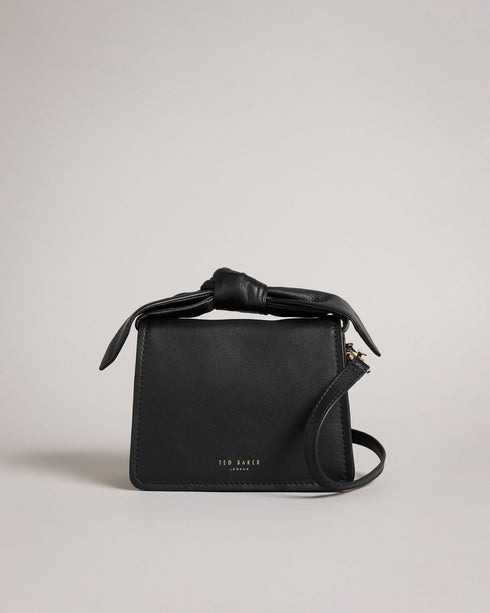NIYAH-Bags-Small in size and big on style, NIYAH is the ideal bag for jazzing up your look. With two ways to carry and a large bow to top it off, you can carry your essentials with confidence. Crossbody bag Mini size Bow detail Adjustable shoulder strap 100% Bovine leather Dimensions: 9cm x 13cm x 17cm- Ted Baker Romania
