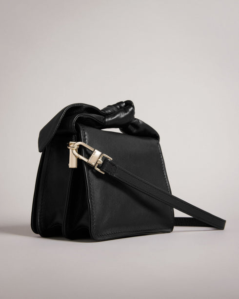 NIYAH-Bags-Small in size and big on style, NIYAH is the ideal bag for jazzing up your look. With two ways to carry and a large bow to top it off, you can carry your essentials with confidence. Crossbody bag Mini size Bow detail Adjustable shoulder strap 100% Bovine leather Dimensions: 9cm x 13cm x 17cm- Ted Baker Romania