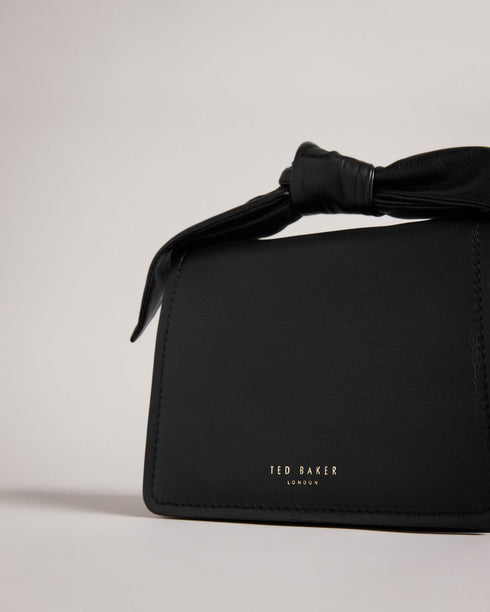 NIYAH-Bags-Small in size and big on style, NIYAH is the ideal bag for jazzing up your look. With two ways to carry and a large bow to top it off, you can carry your essentials with confidence. Crossbody bag Mini size Bow detail Adjustable shoulder strap 100% Bovine leather Dimensions: 9cm x 13cm x 17cm- Ted Baker Romania