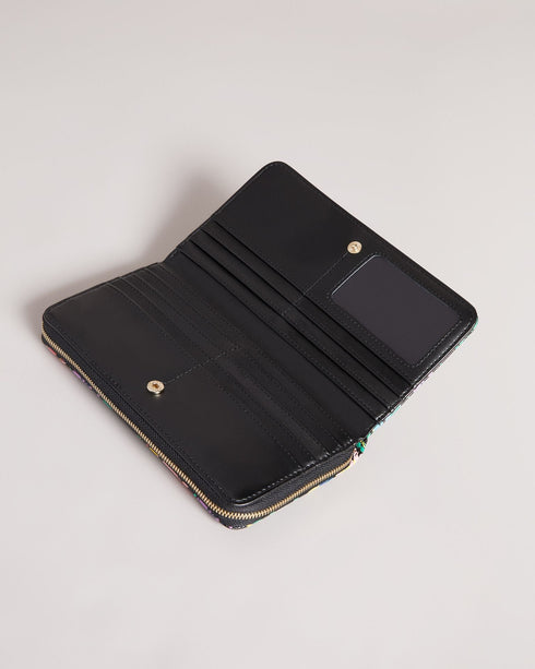 PARCIEA-Small goods-Let your outfit bloom with PARCIEA. This purse will bring the finishing touch to your ensemble with our Sketchy Magnolia print, luxurious glossy leather and a zip fastening to keep your valuables secure. By purchasing this product, you are supporting responsible leather manufacturing through the Leather Working Group. Ted Baker accessories collection Leather purse Popper fastening Card pockets Sketchy Magnolia print Zip closure Ted Baker branded Dimensions: 3cm x 10cm x 19cm- Ted Baker R