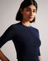 PERINE-Knitwear-Knits are having a moment. PERINE is a cropped cardigan with half-length sleeves and a button-up fastening that'll feel right at home in your wardrobe. Pair with a dress or your favourite jeans to take your look up a level. The fabric of this product is made with 64% recycled viscose. Using recycled materials helps divert fabric waste from ending in landfills and reduces our dependence on virgin materials. Ted Baker womenswear collection Rayon cardigan Cropped length Button fastening Half le